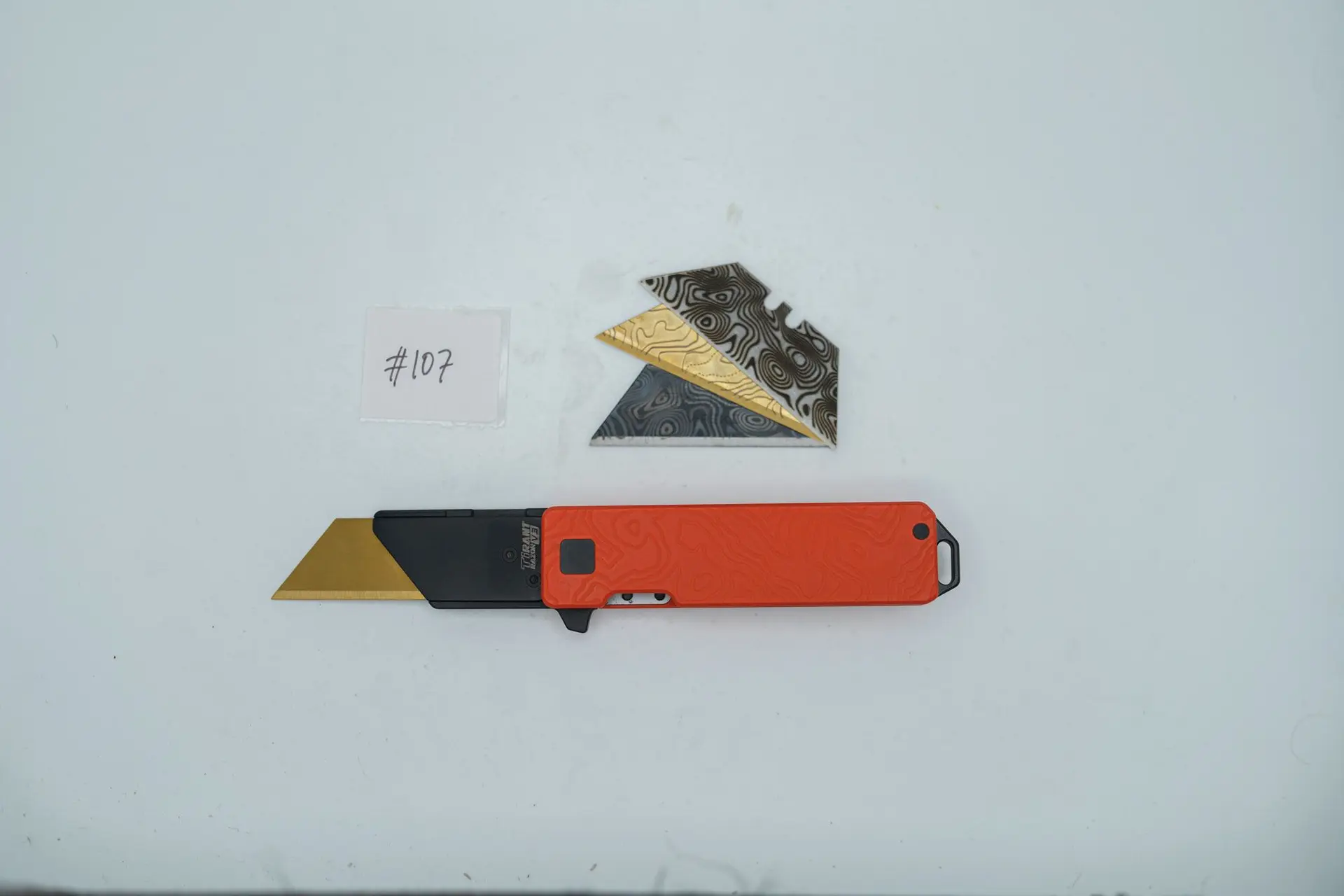 BUILD #107 — Condition 9/10 — TiRant RAZOR V3 Cascadia 3D-Milled Both Sides + Custom Hunter Orange Cerakote + 3 Random Pattern Custom Laser Engraved Razor Blades From The ToolRoom