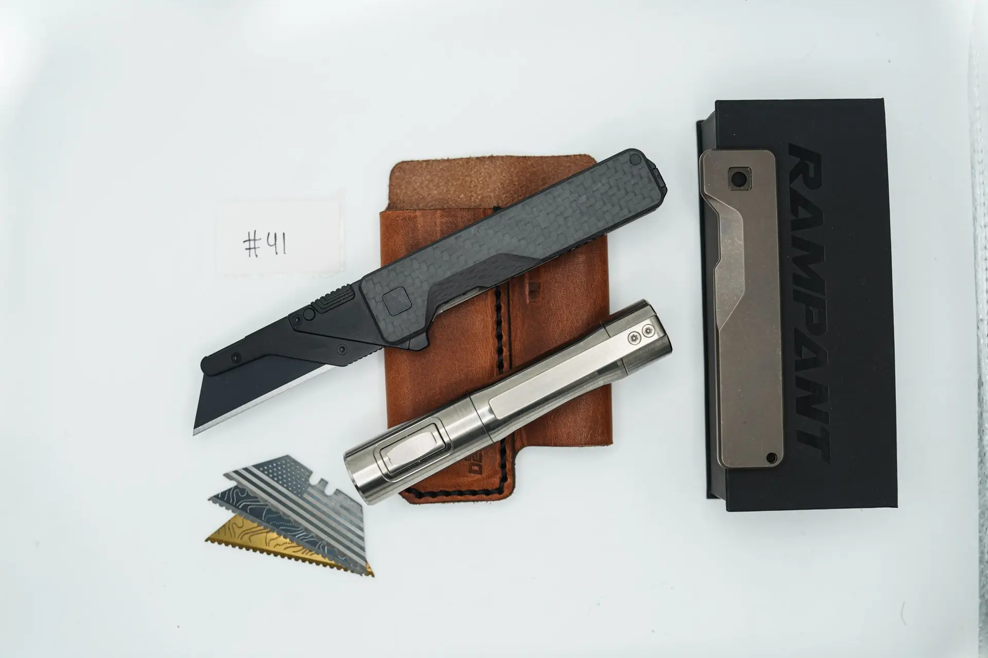 BUILD #41 Combo — Condition 9/10 — TiRant ULTRA Jet-Black PVD 50/50 RH Carbon Fiber Smooth / Bronze And LH Scale + Space Bronze RH Scale + 3X Custom Laser Engraved Razor Blades + RAW 519a Rampant R4 Titanium Flashlight + 9/10 Prototype Brown Leather FieldPro Pocket Organizer