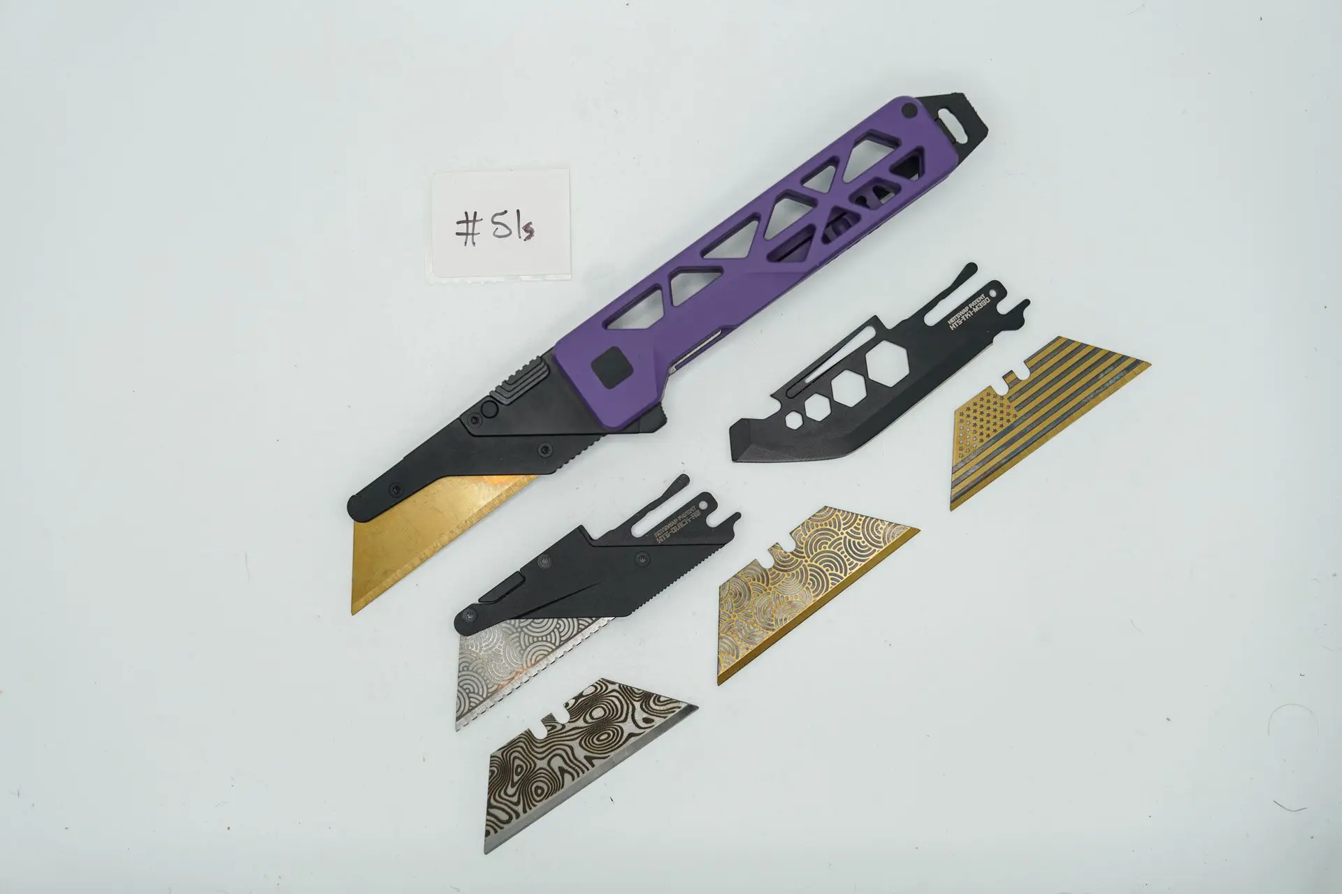 BUILD #51s Combo — Condition 8/10 — TiRant ULTRA Skeleton W/Blemished (see Pics) Custom Purple Ceracoat + Installed SKIFF Bearings + Skeleton Pry Bar Full Backspacer + 4X Custom Laser Engraved Razor Blades + M390 Jet-Black Toolkit Blade + V1 Hotswap Razor Quick Release (V1 For Light Cutting Tasks Only)