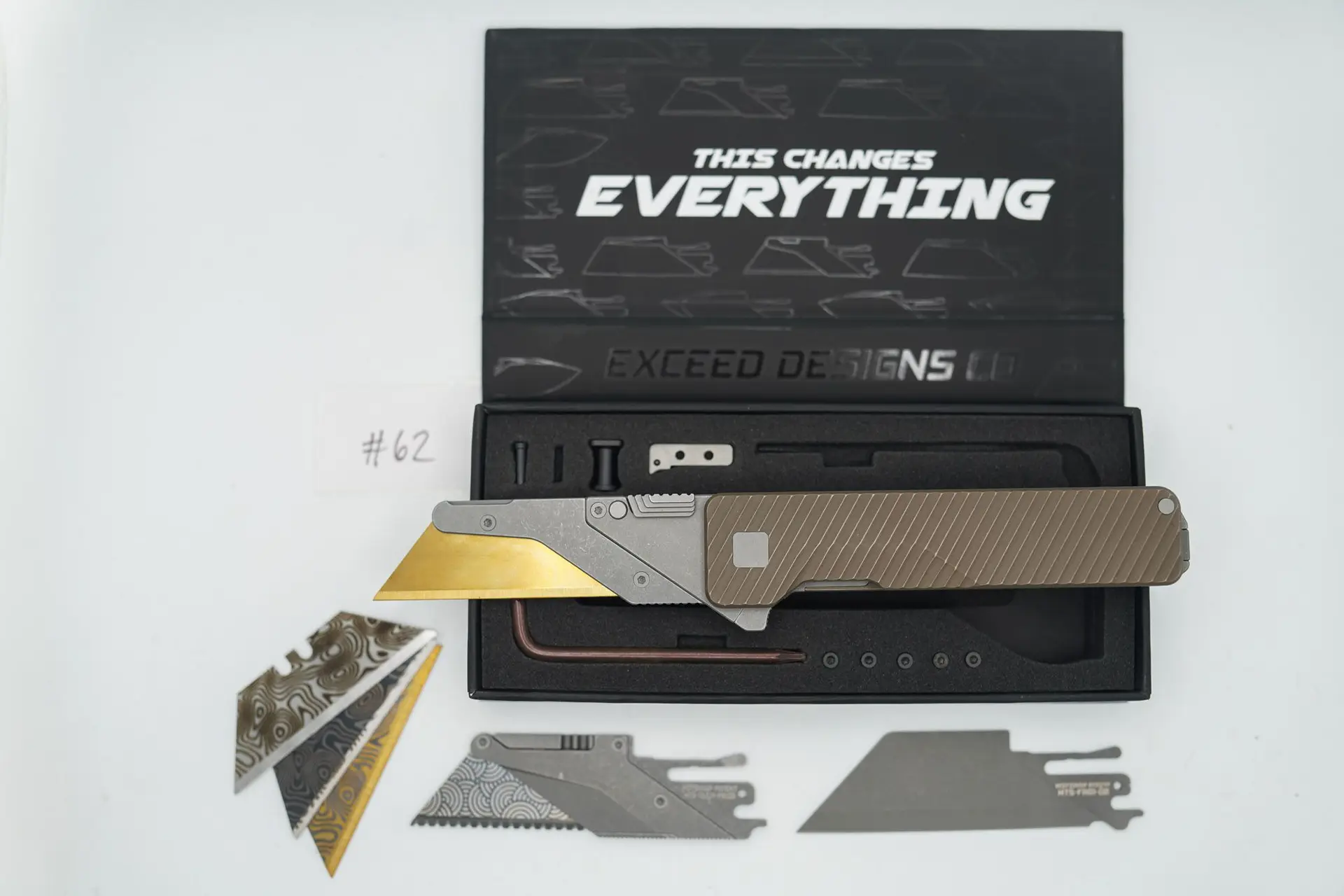 BUILD #62 — Condition 10/10 — TiRant ULTRA Dual Milled SLASH W/Centurion Bronze ANO + Original Box W/ Spare Jet-Black Hardware Kit / Lock Bar insert + V2 Razor Quick Release Hotswap Insert (Slight Surface Blem) + D2 Stonewashed Full Razor Hotswap Blade + 4X Custom Laser Engraved Razor Blades