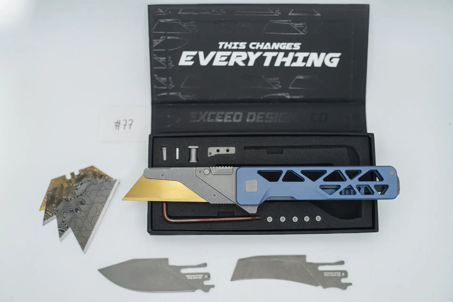 BUILD #77 — Condition 9/10 — TiRant ULTRA Skeleton ‘SKULTRA’ Custom Aqua-BLUE Titanium ANO W/Blasted Grey Hardware + Original Box W/Spare Grey Blasted Hardware Kit / Lock Bar insert + D2 Stonewashed Hawkbill Hotswap Blade + D2 Stonewashed Drop Point Hotswap Blade + 4X Custom Laser Engraved Razor Blades