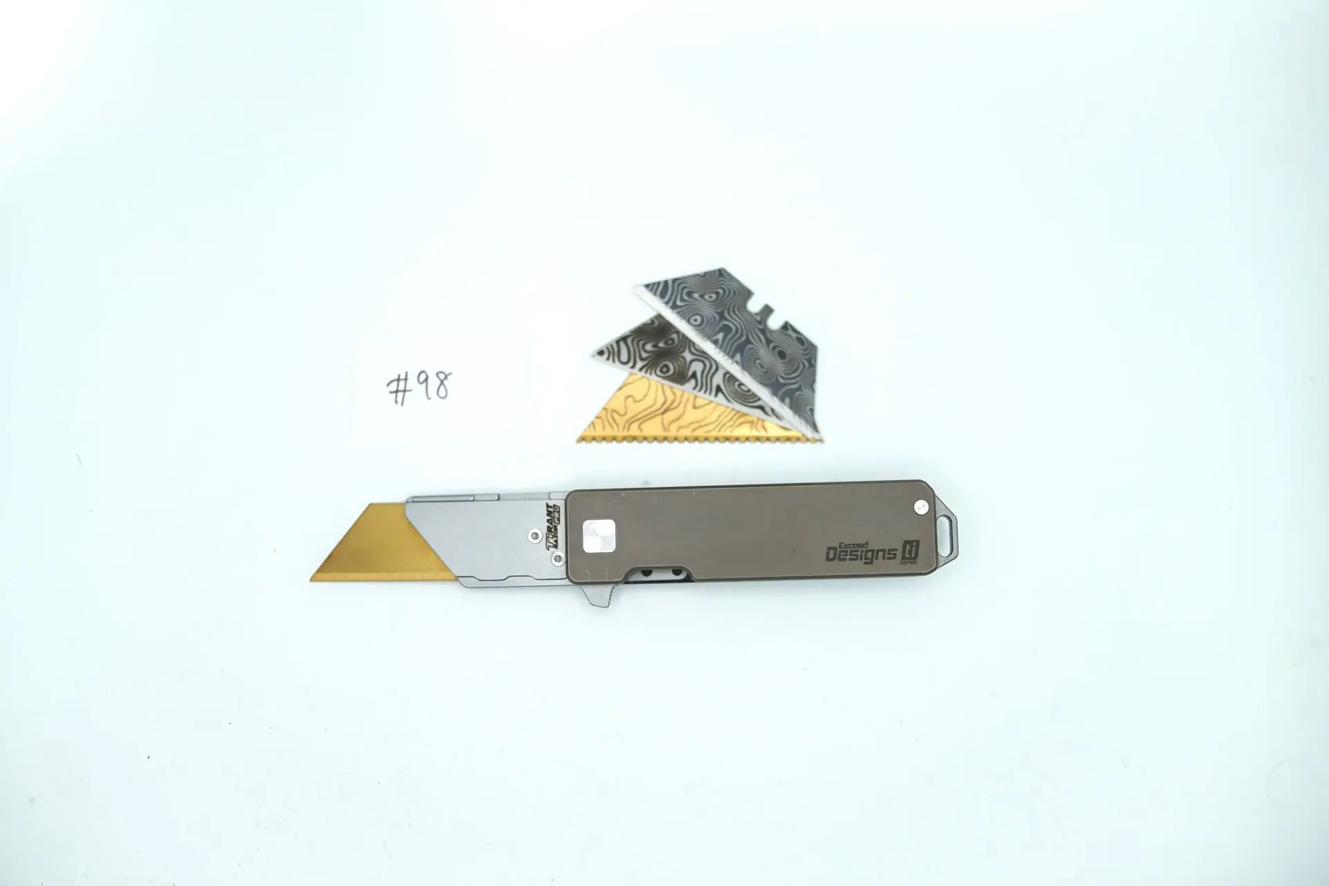 BUILD #98 — Condition 8/10 — TiRant RAZOR V3 50/50 Contrast Jet-Black Topo Milled LH Scale + Smooth Centurion Bronze RH Scale – 3 Custom Laser Engraved Razor Blades From The ToolRoom
