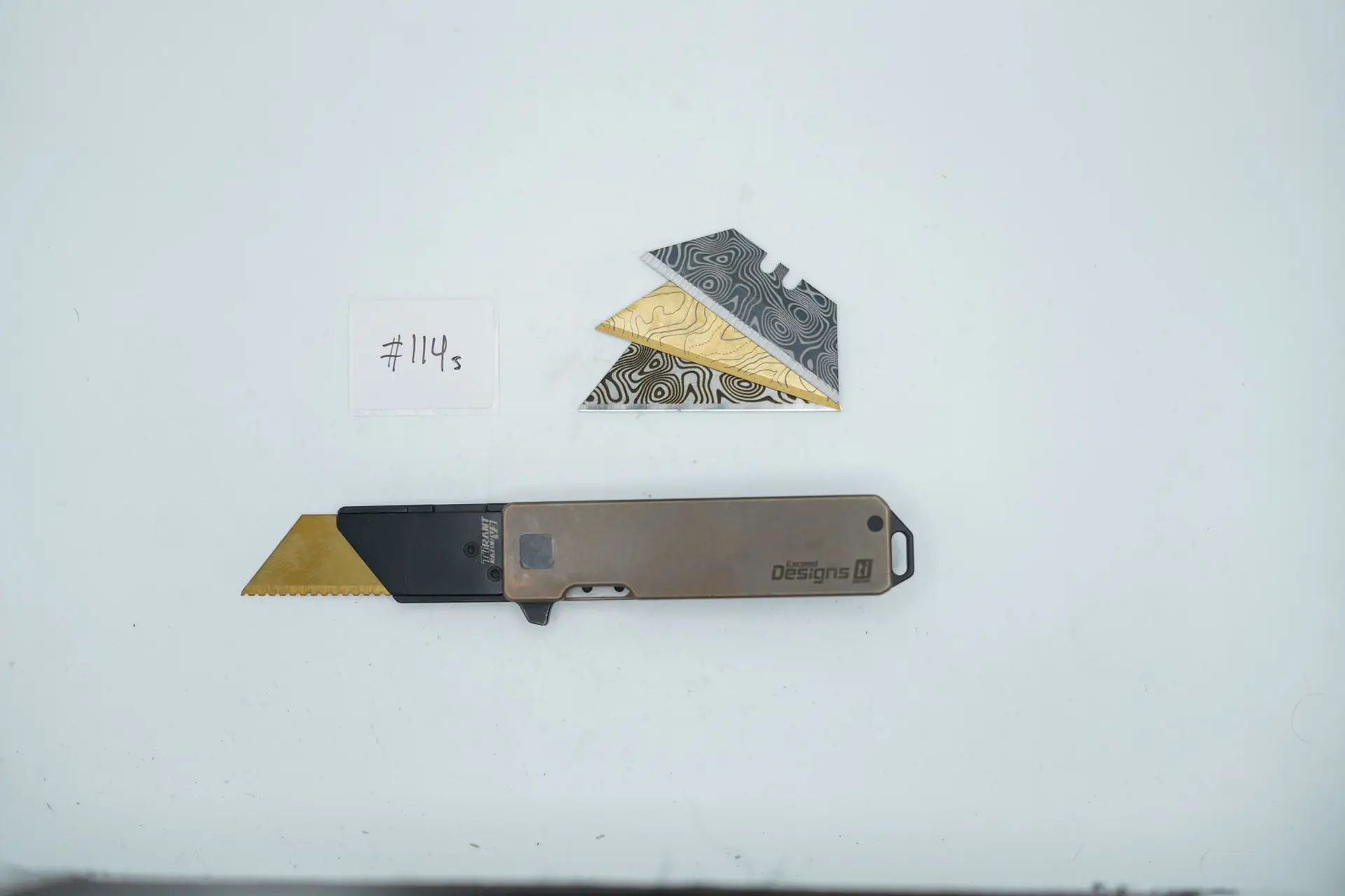BUILD #114s — Condition 7/10 — TiRant RAZOR V3 Dual-Sided Centurion Bronze ANO + SKIFF Bearings Pre-Installed + Blemished 38mm Mini Clip + 3 Custom Laser Engraved Razor Blades From The ToolRoom