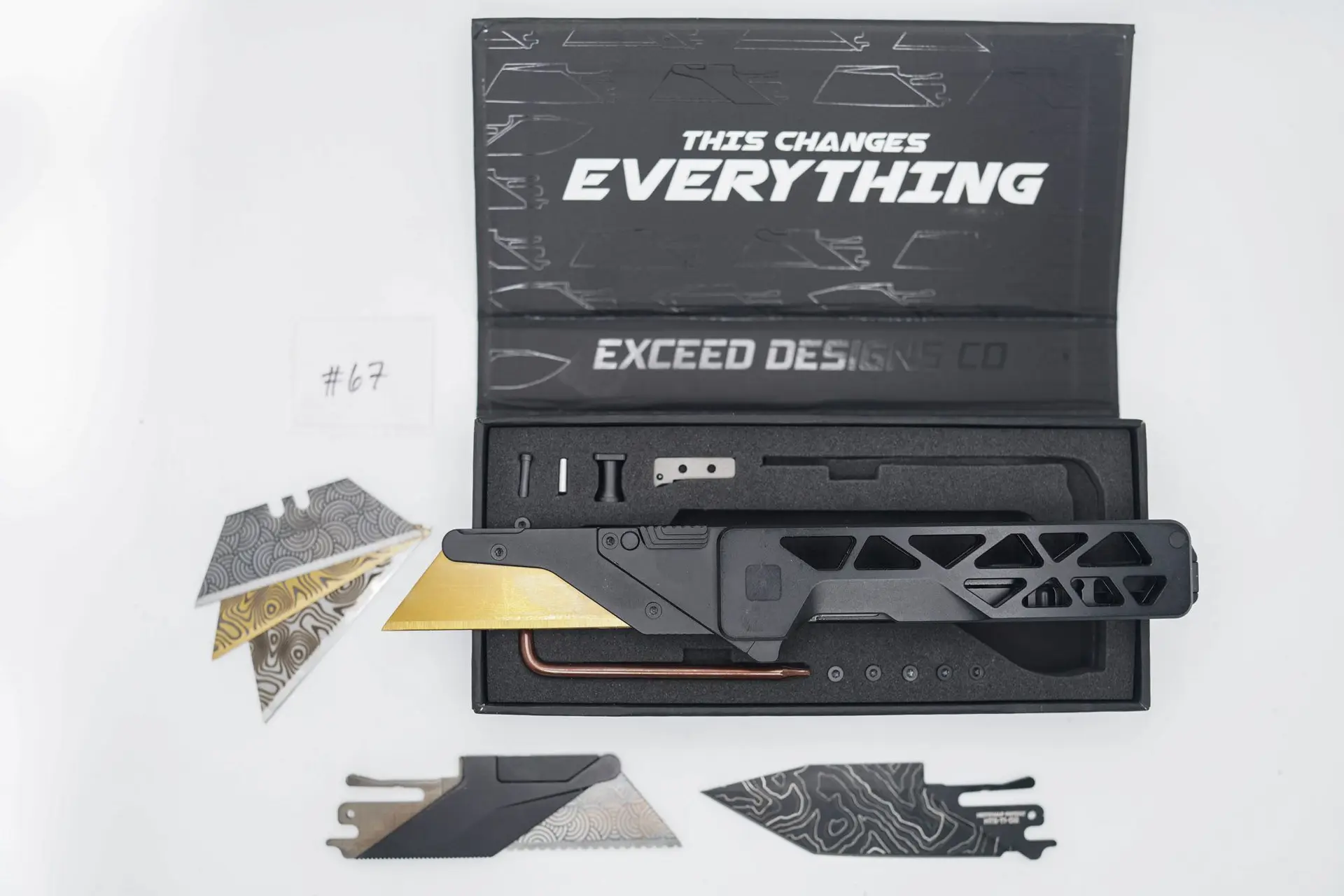 BUILD #67 — Condition 7/10 — TiRant ULTRA Skeleton ‘SKULTRA’ Jet-Black PVD + V2 Razor Blade Quick Release HotSwap Insert (Laser-etched Fitmet Area) + Original Box W/Spare Jet-Black PVD Hardware Kit / Lock Bar insert + D2 Jet-Black TOPO Lasered Tanto Hotswap Blade + 3X Custom Laser Engraved Razor Blades