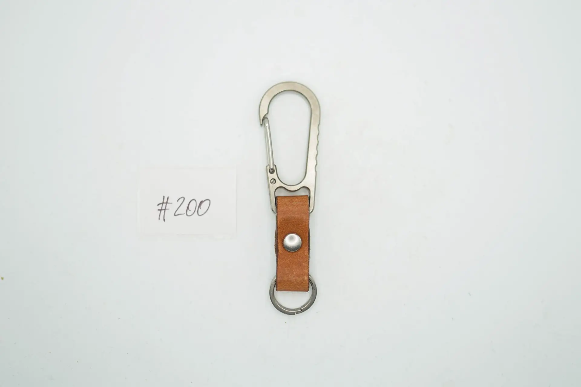 BUILD #200 Condition 10/10 — V1 Titanium Carabiner W/Tio Key Ring – Light Stonewash Ti + Natural Tan Leather + Silver Rivets