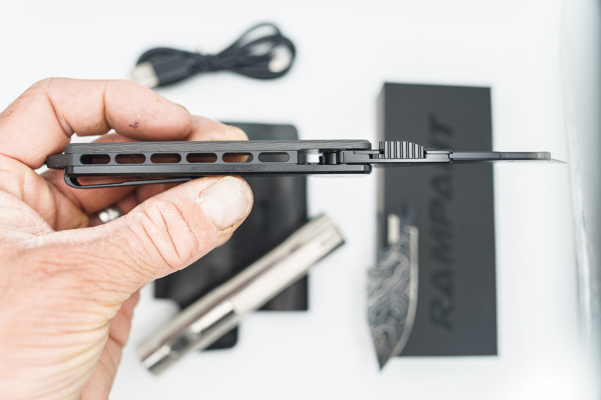 BUILD #45 Combo — Condition 9/10 — TiRant ULTRA 50/50 Carbon Fiber RH Scale / Jet-Black PVD Titanium LH Scale + Skeleton Glass Breaker Loop Backspacer + D2 Topo Half Laser Engraved Drop Point Hotswap Blade + 4X Custom Laser Engraved Razor Blades + 10/10 RAW 519a Rampant R4 Aluminum Flashlight + 10/10 Black Leather FieldPro Pocket Organizer W/Belt Loop - Image 5