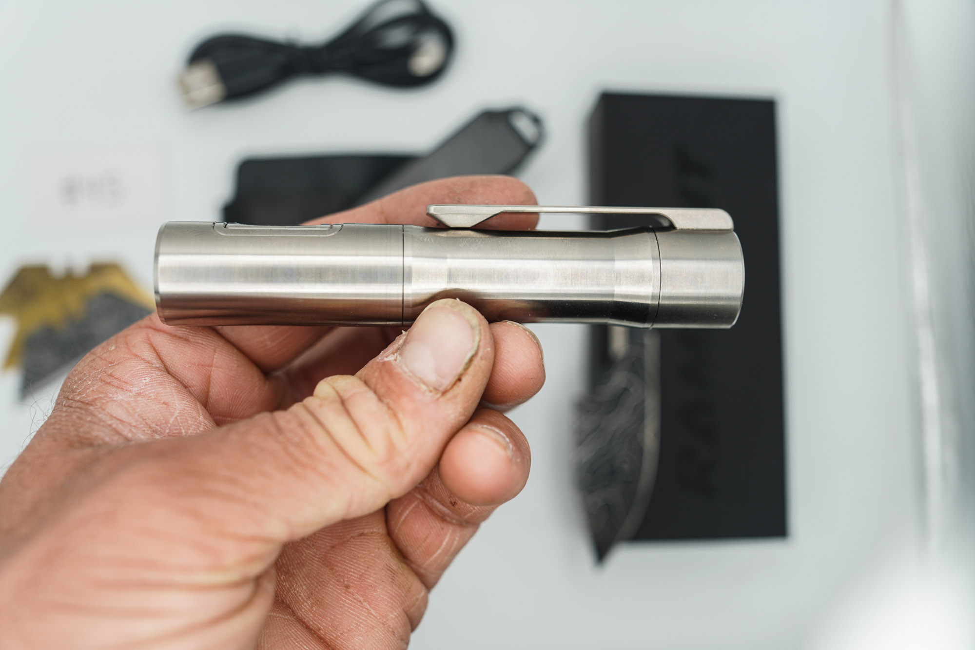 BUILD #45 Combo — Condition 9/10 — TiRant ULTRA 50/50 Carbon Fiber RH Scale / Jet-Black PVD Titanium LH Scale + Skeleton Glass Breaker Loop Backspacer + D2 Topo Half Laser Engraved Drop Point Hotswap Blade + 4X Custom Laser Engraved Razor Blades + 10/10 RAW 519a Rampant R4 Aluminum Flashlight + 10/10 Black Leather FieldPro Pocket Organizer W/Belt Loop - Image 7