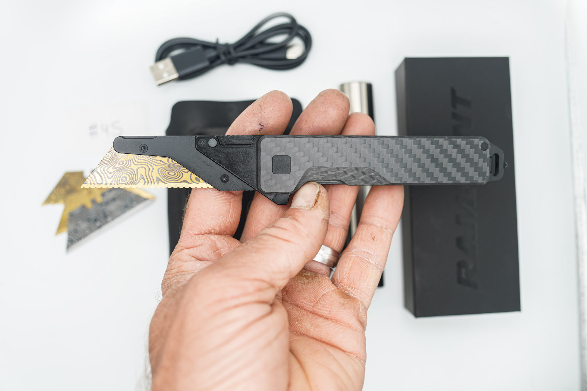 BUILD #45 Combo — Condition 9/10 — TiRant ULTRA 50/50 Carbon Fiber RH Scale / Jet-Black PVD Titanium LH Scale + Skeleton Glass Breaker Loop Backspacer + D2 Topo Half Laser Engraved Drop Point Hotswap Blade + 4X Custom Laser Engraved Razor Blades + 10/10 RAW 519a Rampant R4 Aluminum Flashlight + 10/10 Black Leather FieldPro Pocket Organizer W/Belt Loop - Image 14