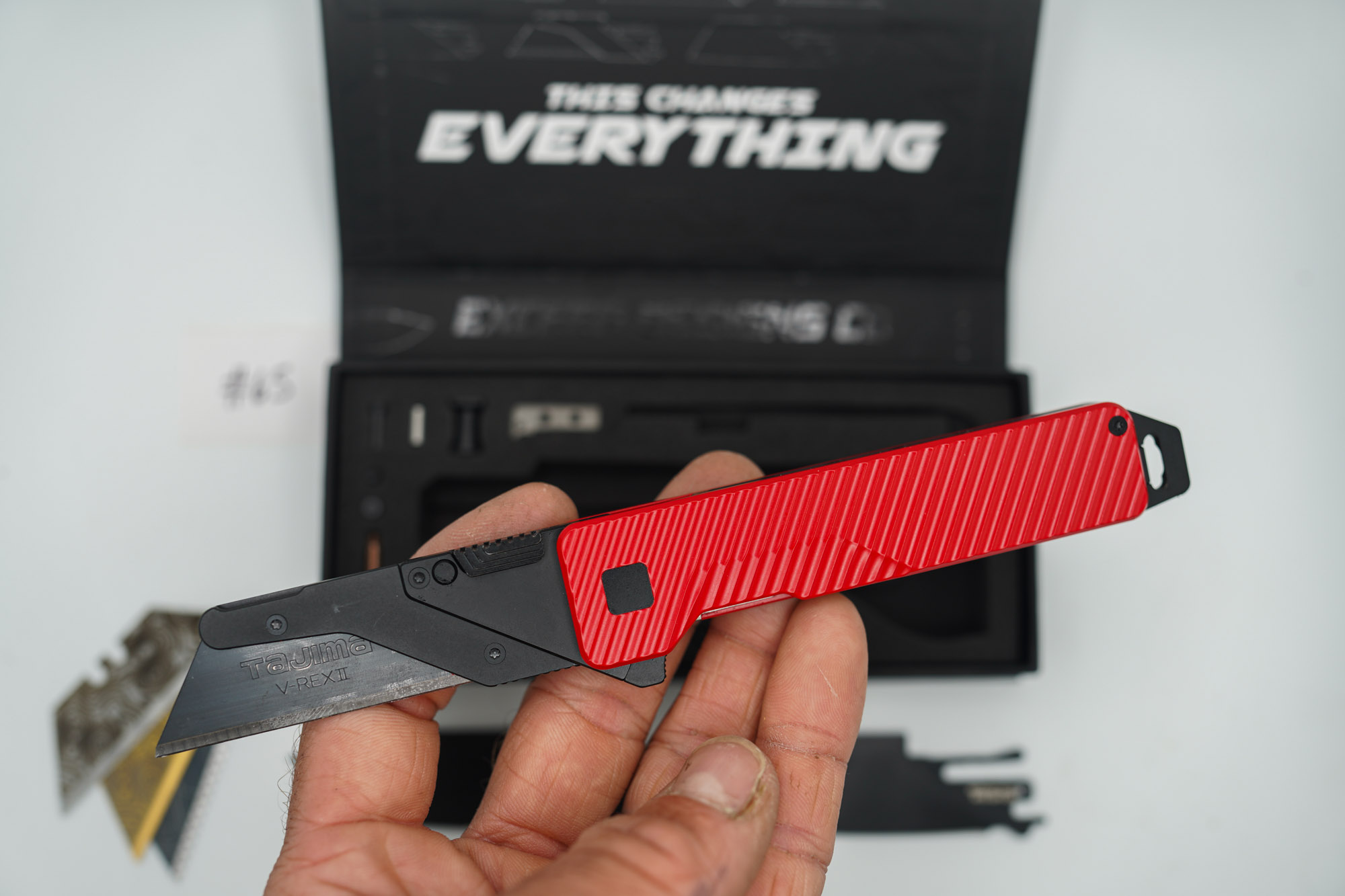 BUILD #65 — Condition 9/10 — TiRant ULTRA Dual Milled SLASH W/Custom Bright Red Cerakote + Installed Full-Length Skeleton Stonewash Pry Bar Backspacer + Original Box W/ Spare Jet-Black PVD Hardware Kit / Lock Bar insert + D2 Jet-Black Tanto Hotswap Blade + D2 Jet-Black Drop Point Hotswap Blade + 3X Custom Laser Engraved Razor Blades - Image 5