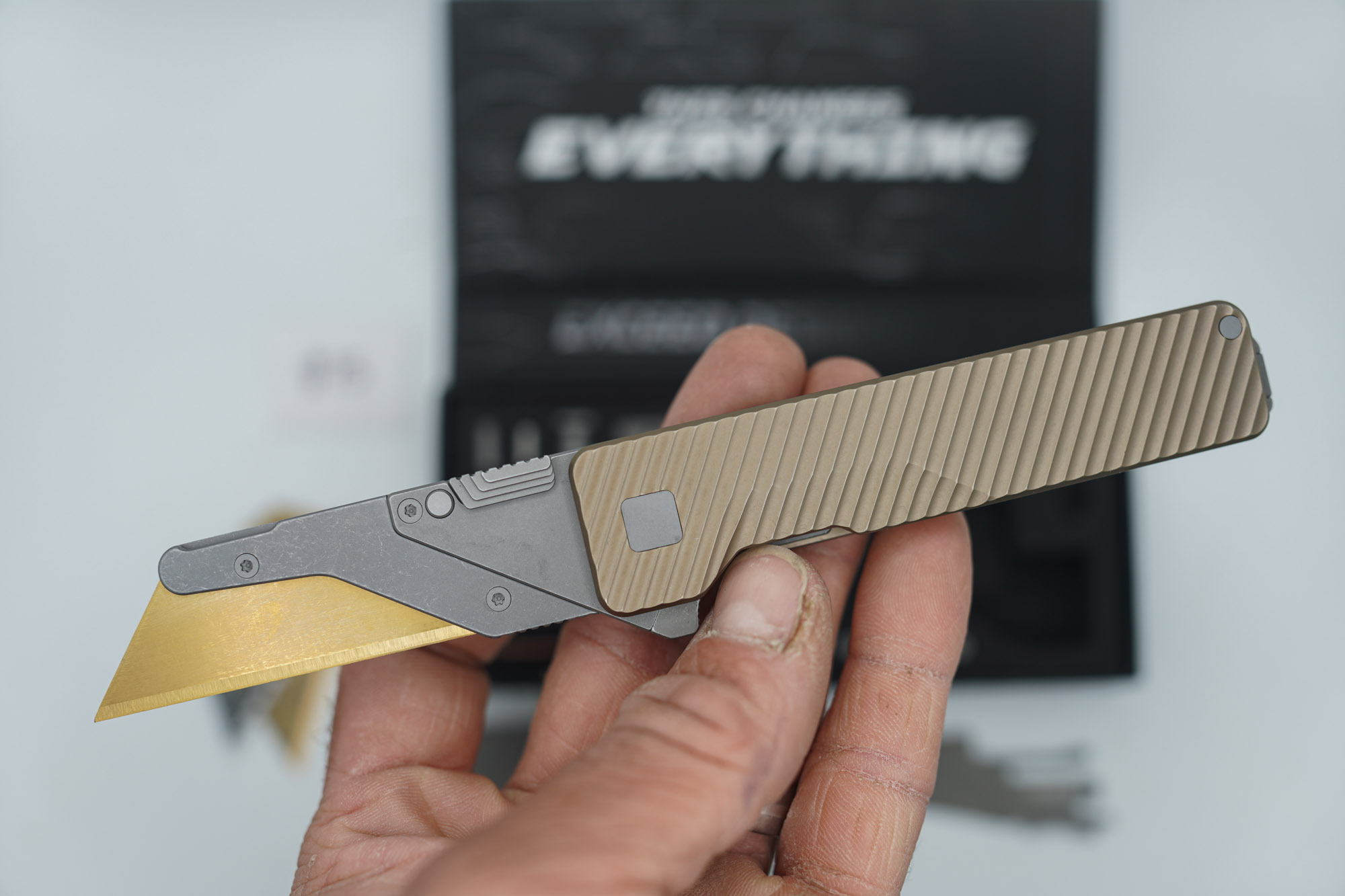 BUILD #75 — Condition 9/10 — TiRant ULTRA Deep-Slash DUAL Milled Centurion Light-Bronze - Minor Blem in ANO finish (See Photos) W/Blasted Grey Hardware + Original Box W/Spare Grey Blasted Hardware Kit / Lock Bar insert + D2 Stonewashed Hawkbill Hotswap Blade + D2 Stonewashed Drop Point Hotswap Blade + 3X Custom Laser Engraved Razor Blades - Image 3