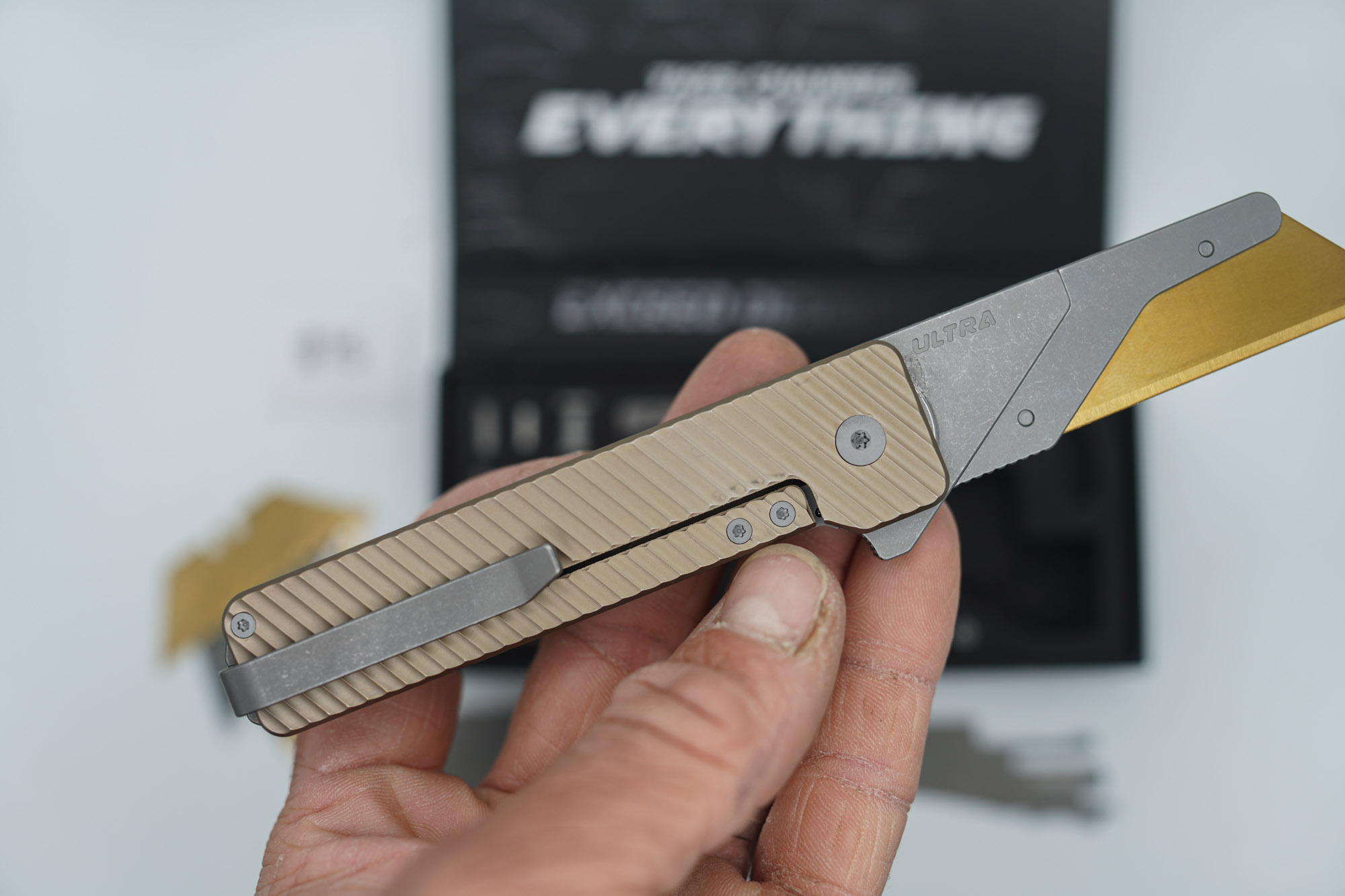 BUILD #75 — Condition 9/10 — TiRant ULTRA Deep-Slash DUAL Milled Centurion Light-Bronze - Minor Blem in ANO finish (See Photos) W/Blasted Grey Hardware + Original Box W/Spare Grey Blasted Hardware Kit / Lock Bar insert + D2 Stonewashed Hawkbill Hotswap Blade + D2 Stonewashed Drop Point Hotswap Blade + 3X Custom Laser Engraved Razor Blades - Image 4
