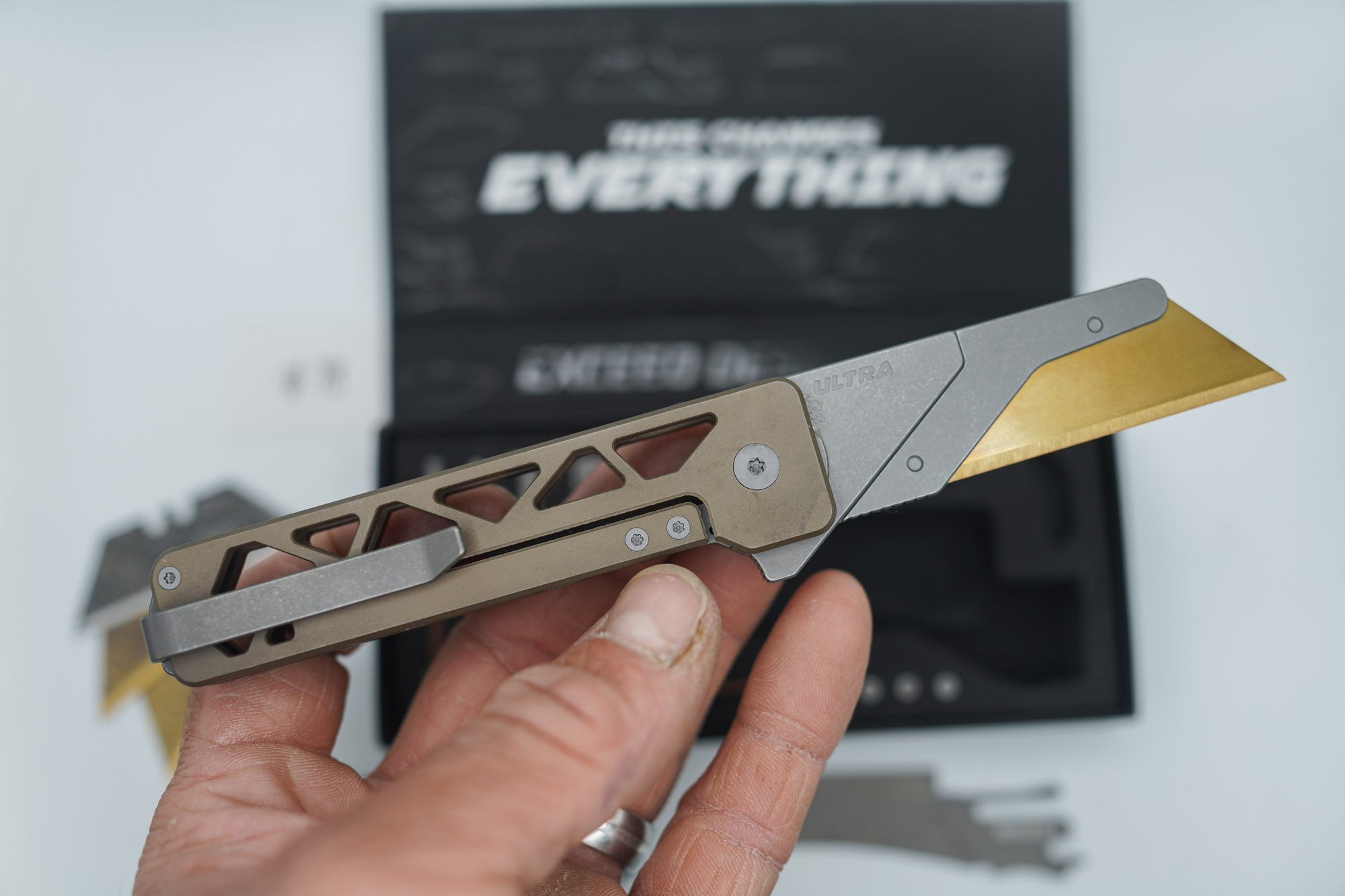 BUILD #78 — Condition 8/10 — TiRant ULTRA Skeleton 'SKULTRA' Centurion Bronze W/Blasted Grey Hardware + Original Box W/Spare Grey Blasted Hardware Kit / Lock Bar insert + D2 Hawkbill Hotswap Blade + D2 Jet-Black Drop Point Hotswap Blade + 3X Custom Laser Engraved Razor Blades - Image 2