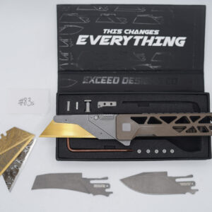BUILD #83s — Condition 8/10 — TiRant ULTRA Skeleton 'SKULTRA' Centurion Bronze W/Blasted Grey Hardware + Original Box W/Spare Grey Blasted Hardware Kit / Lock Bar insert + Pre-Installed SKIFF Bearings + FULL-FRAG Stonewashed Dark Grey Ti Backspacer + D2 Stonewashed Hawkbill Hotswap Blade + D2 Stonewashed Drop Point Hotswap Blade + 3X Custom Laser Engraved Razor Blades